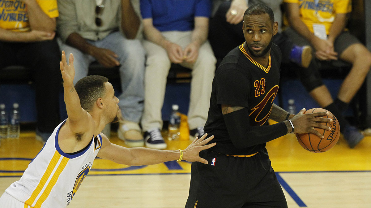Cleveland Cavaliers forward LeBron James (23) controls the ball against Golden State Warriors guard Stephen Curry (30) in the second half in game seven of the NBA Finals at Oracle Arena.