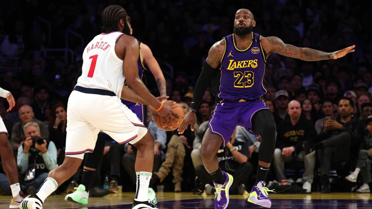 Los Angeles Lakers forward LeBron James (23) defends LA Clippers guard James Harden (1) during the fourth quarter at Crypto.com Arena.