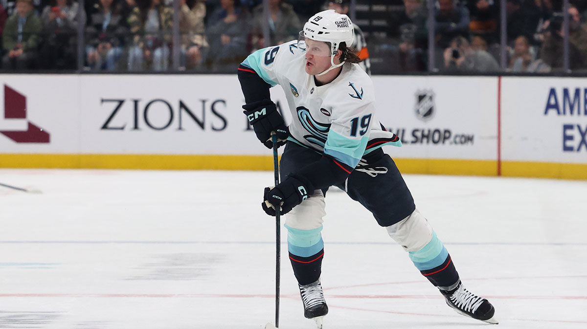 Seattle Kraken left wing Jared McCann (19) skates with the puck against Utah Hockey Club during the first period at Delta Center.