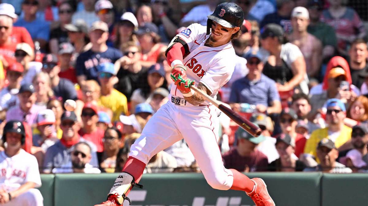 Boston Red Sox left fielder Jarren Duran (16) hits a triple against the Toronto Blue Jays during the sixth inning at Fenway Park.