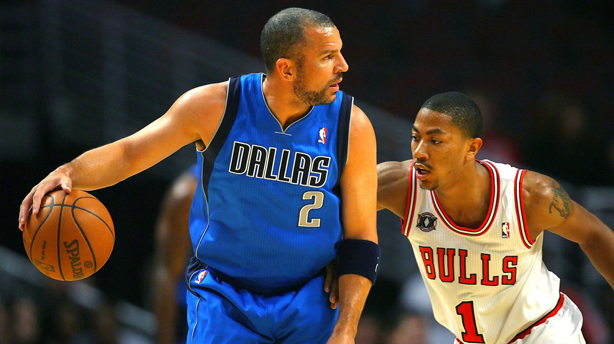 Dallas Mavericks point guard Jason Kidd (2) is defended by Chicago Bulls point guard Derrick Rose (1) in the first half at the United Center.