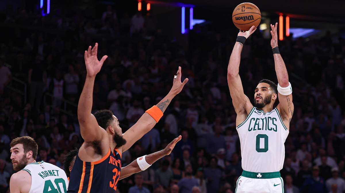 Boston Celtics forward Jayson Tatum (0) shoots the ball as New York Knicks center Karl-Anthony Towns (32) defends in the second half during game four of the second round for the 2025 NBA Playoffs at Madison Square Garden.