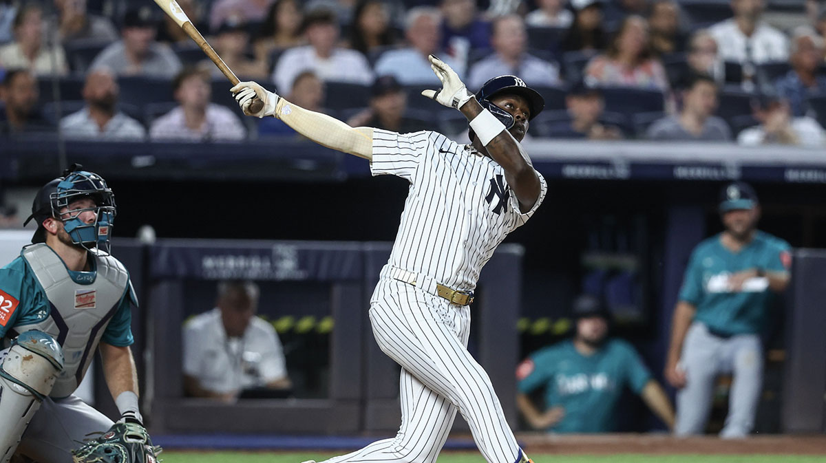 Jul 9, 2025; Bronx, New York, USA; New York Yankees second baseman Jazz Chisholm Jr. (13) hits a two run home run in the fifth inning against the Seattle Mariners at Yankee Stadium.