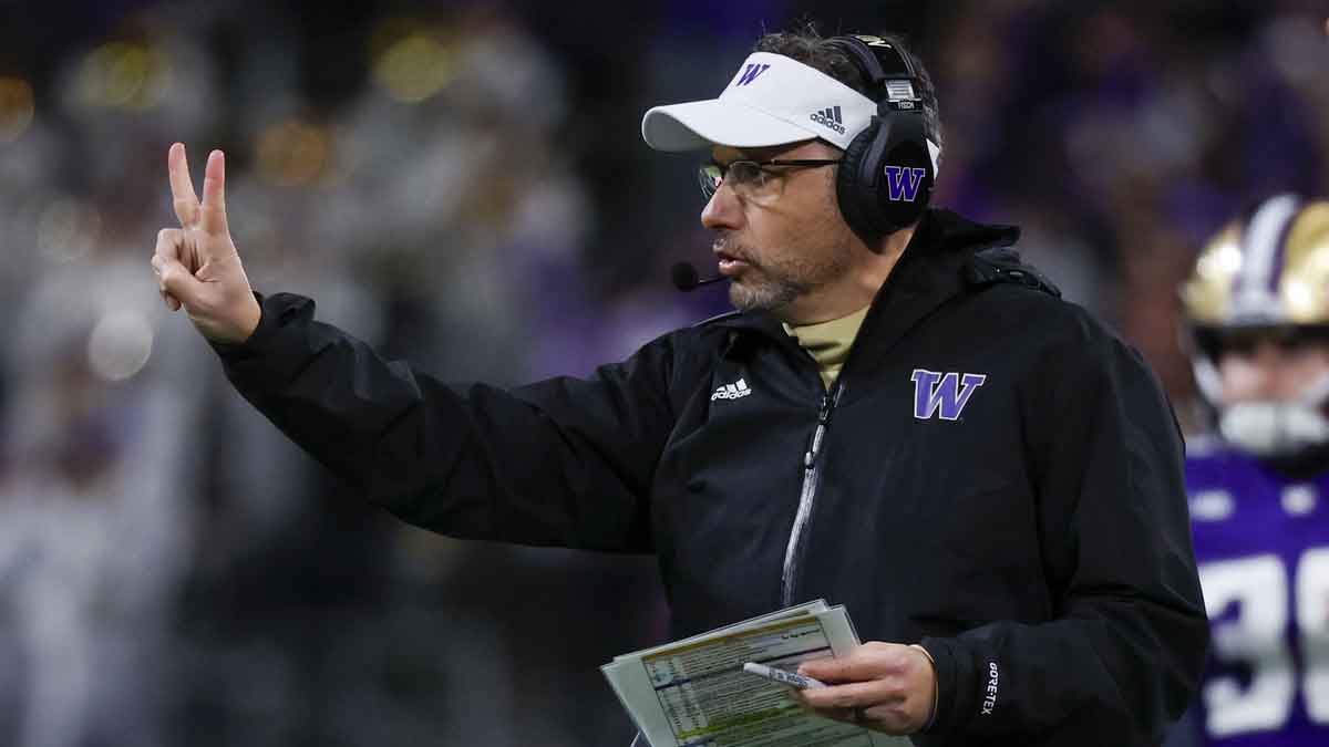 Washington Huskies head coach Jedd Fisch signals for a two-point conversion try against the USC Trojans following a touchdown during the fourth quarter at Alaska Airlines Field at Husky Stadium.