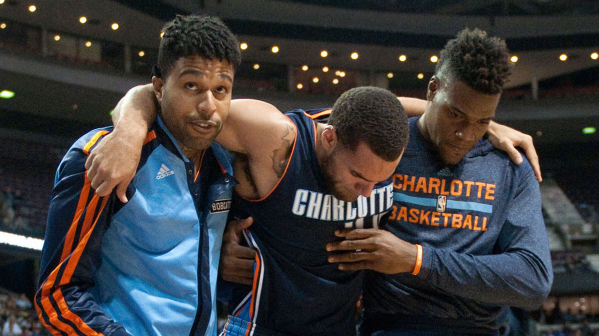 Charlotte Bobcats shooting guard Jeff Taylor (44) is helped off the court by teammates after being injured during the first quarter against the Detroit Pistons at The Palace of Auburn Hills.
