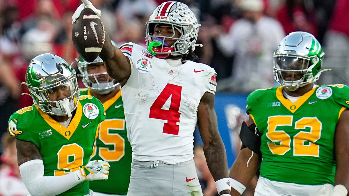Ohio State Buckeyes wide receiver Jeremiah Smith (4) celebrates a first down catch during the second half of the College Football Playoff quarterfinal against the Oregon Ducks at the Rose Bowl in Pasadena, Calif. on Jan. 1, 2025. Ohio State won 41-21.