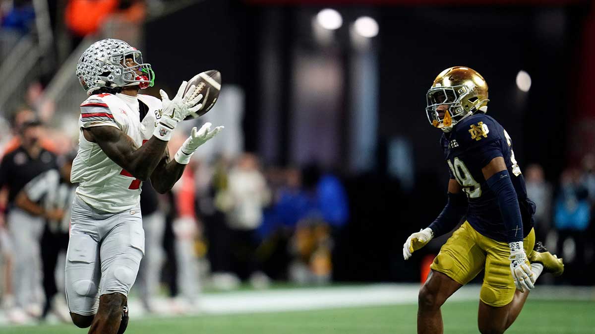Ohio State Buckeyes wide receiver Jeremiah Smith (4) makes a catch against Notre Dame Fighting Irish cornerback Christian Gray (29) in the fourth quarter during the College Football Playoff National Championship