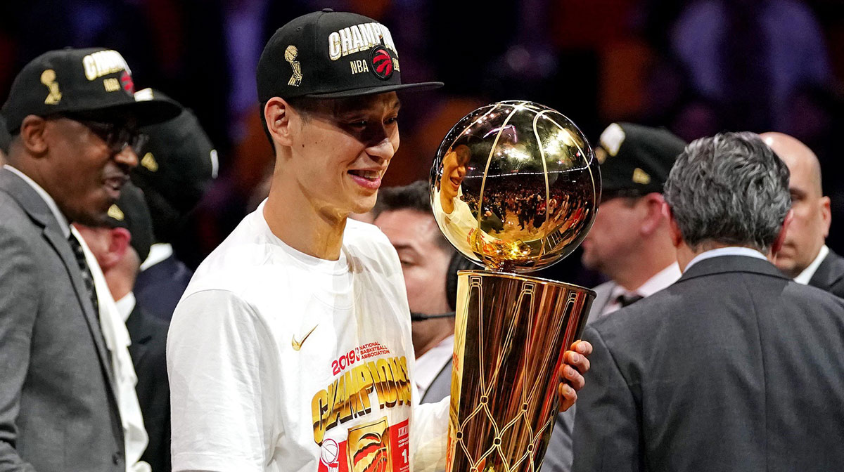 Toronto Raptors guard Jeremy Lin (17) celebrates with the Larry O'Brian Trophy after beating the Golden State Warriors in game six of the 2019 NBA Finals at Oracle Arena.
