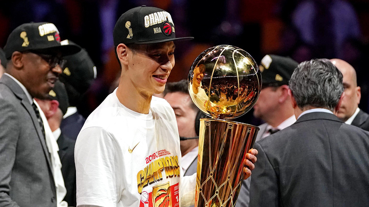Toronto Raptors guard Jeremy Lin (17) celebrates with the Larry O'Brian Trophy after beating the Golden State Warriors in game six of the 2019 NBA Finals at Oracle Arena.