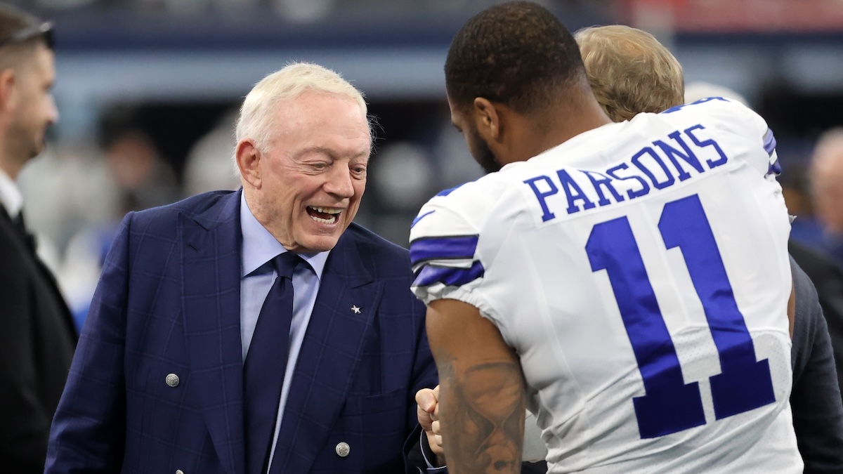 Dallas Cowboys owner Jerry Jones meets with outside linebacker Micah Parsons (11) prior to the NFC Wild Card playoff football game against the San Francisco 49ers at AT&T Stadium.