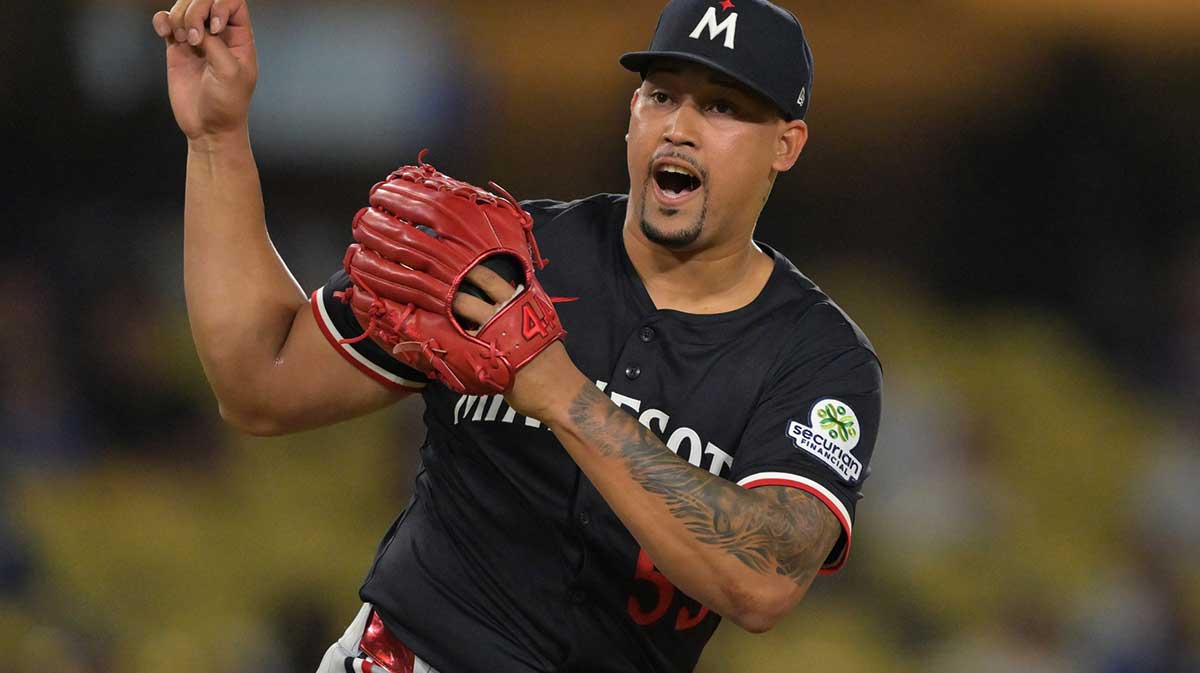 Minnesota Twins relief pitcher Jhoan Duran (59) reacts after the final out of the ninth inning against the Los Angeles Dodgers at Dodger Stadium.