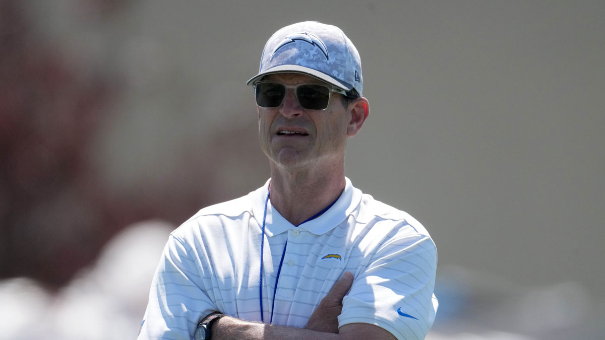 Los Angeles Chargers coach Jim Harbaugh looks on during offseason workouts at The Bolt.