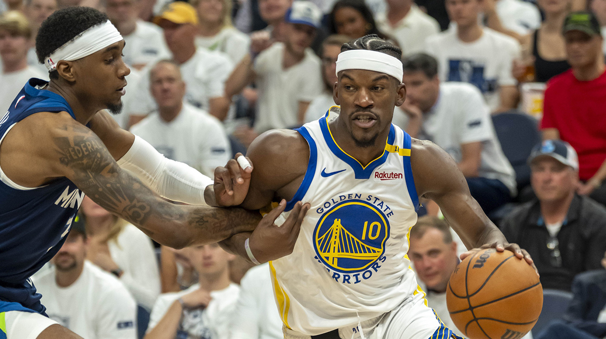 Golden State Warriors forward Jimmy Butler III (10) drives to the basket past Minnesota Timberwolves forward Jaden McDaniels (3) in the second half during game five of the second round for the 2025 NBA Playoffs at Target Center.