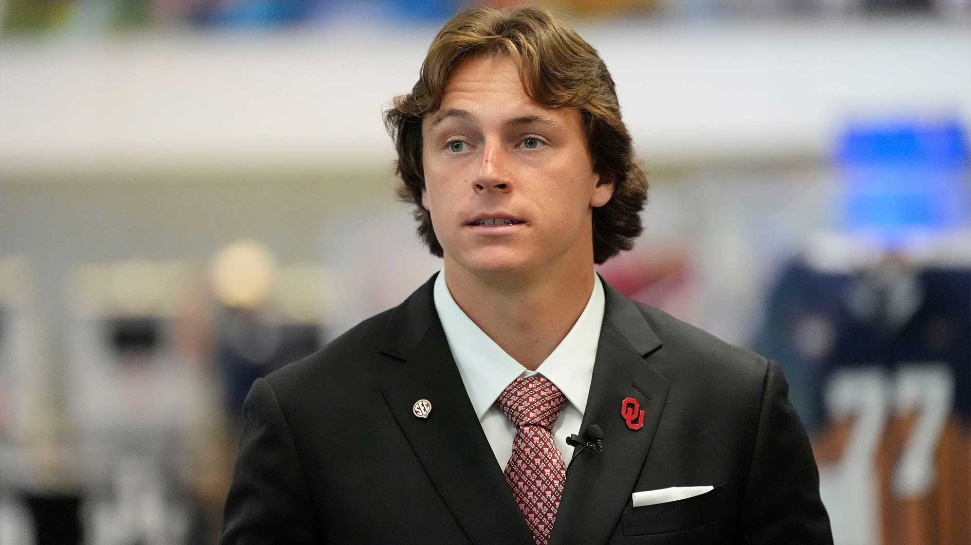 Oklahoma quarterback John Mateer enters the Main Media Room during SEC Media Days at the College Football Hall of Fame in Atlanta.