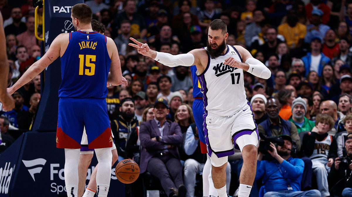 Sacramento Kings center Jonas Valanciunas (17) reacts after a play as Denver Nuggets center Nikola Jokic (15) looks on in the second quarter at Ball Arena.