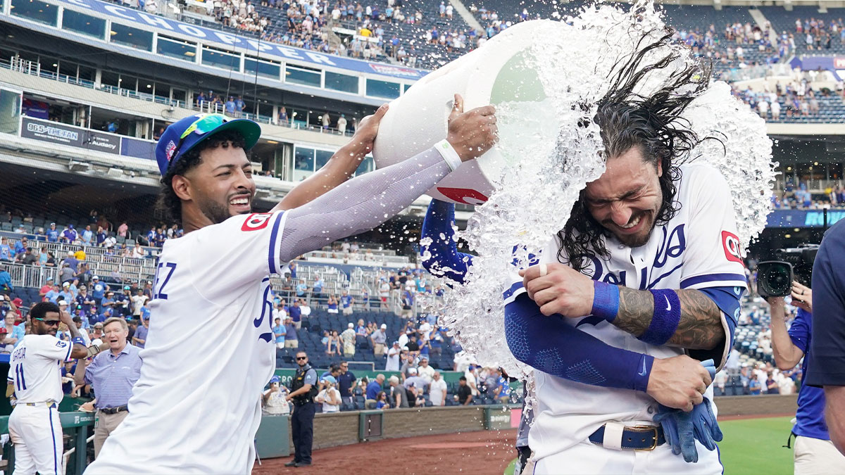 Kansas City Royals designated hitter Jonathan India (6) is doused by left fielder MJ Melendez (1) after hitting a three run walk off home run against the Cleveland Guardians in the tenth inning at Kauffman Stadium.