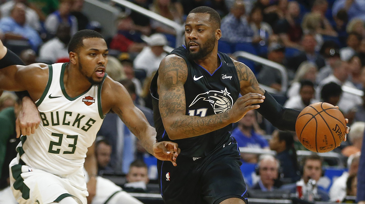 Orlando Magic forward Jonathon Simmons (17) drives past Milwaukee Bucks guard Sterling Brown (23) during the second quarter at Amway Center.