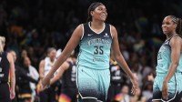 New York Liberty center Jonquel Jones (35) celebrates after hitting a three-point shot in the third quarter against the Phoenix Mercury at Barclays Center.