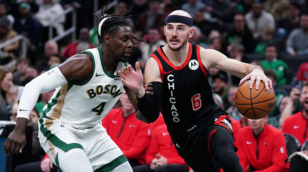 Chicago Bulls guard Alex Caruso (6) drives the ball against Boston Celtics guard Jrue Holiday (4) in the second half at TD Garden.