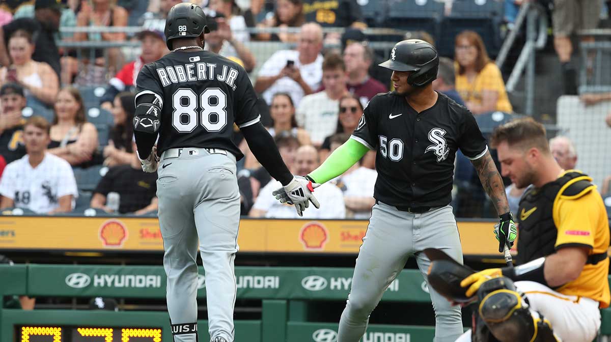 Chicago White Sox second baseman Lenyn Sosa (50) greets center fielder Luis Robert Jr. (88) returning to the dugout with a solo home run against the Pittsburgh Pirates during the fourth inning at PNC Park. Mandatory Credit: Charles LeClaire-Imagn Images