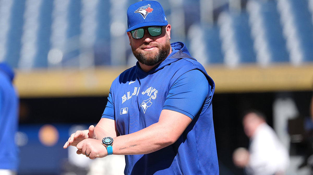 Toronto Blue Jays manager John Schneider (14) walks onto the field during practice before a game against the New York Yankees at Rogers Centre. Mandatory Credit: Nick Turchiaro-Imagn