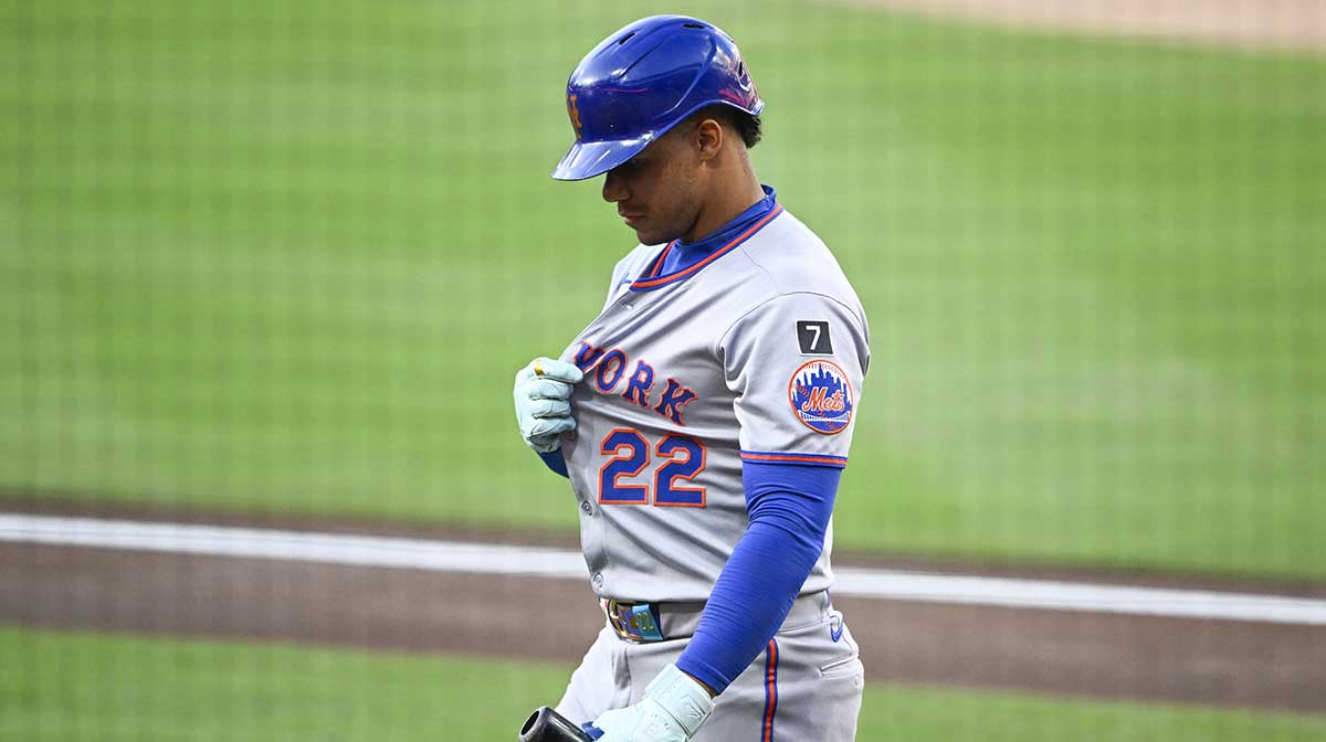 New York Mets right fielder Juan Soto (22) walks back to the dugout after striking out during the first inning against the San Diego Padres at Petco Park. Mandatory Credit: Denis Poroy-Imagn Images