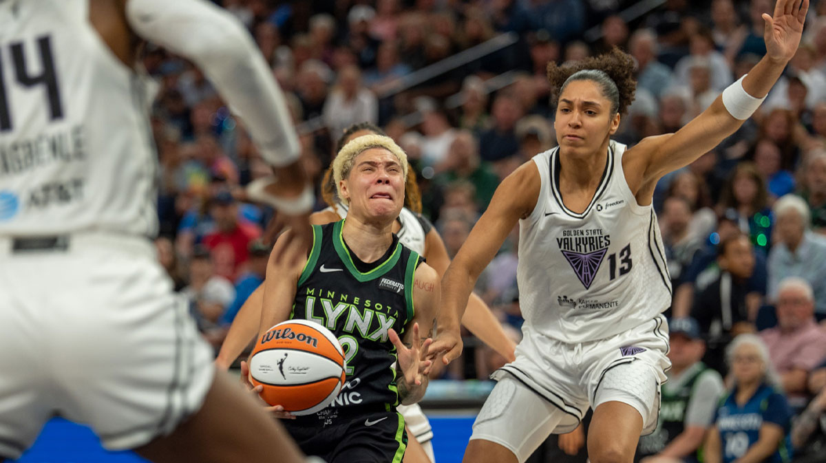 Minnesota Lynx guard Natisha Hiedeman (2) drives on Golden State Valkyries forward Janelle Salaun (13) and center Temi Fagbenle (14) in the fourth quarter at Target Center.