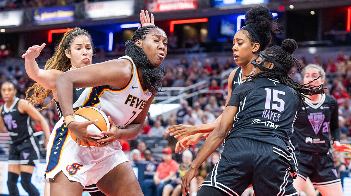Indiana Fever forward Aliyah Boston (7) is surrounded by Golden State Valkyries players in the first half at Gainbridge Fieldhouse.
