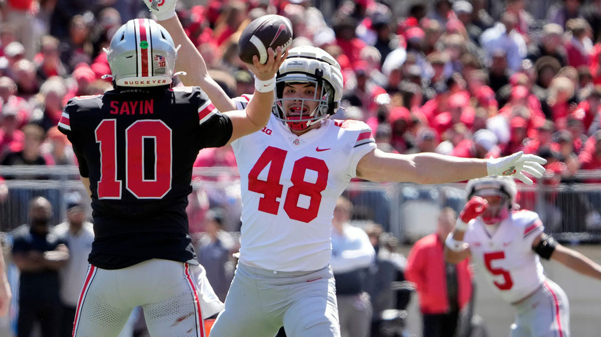 Ohio State Buckeye Scarlet Julian Sayin (10) throws a pass against Gary Logan George (48) in the 1st half during the spring game