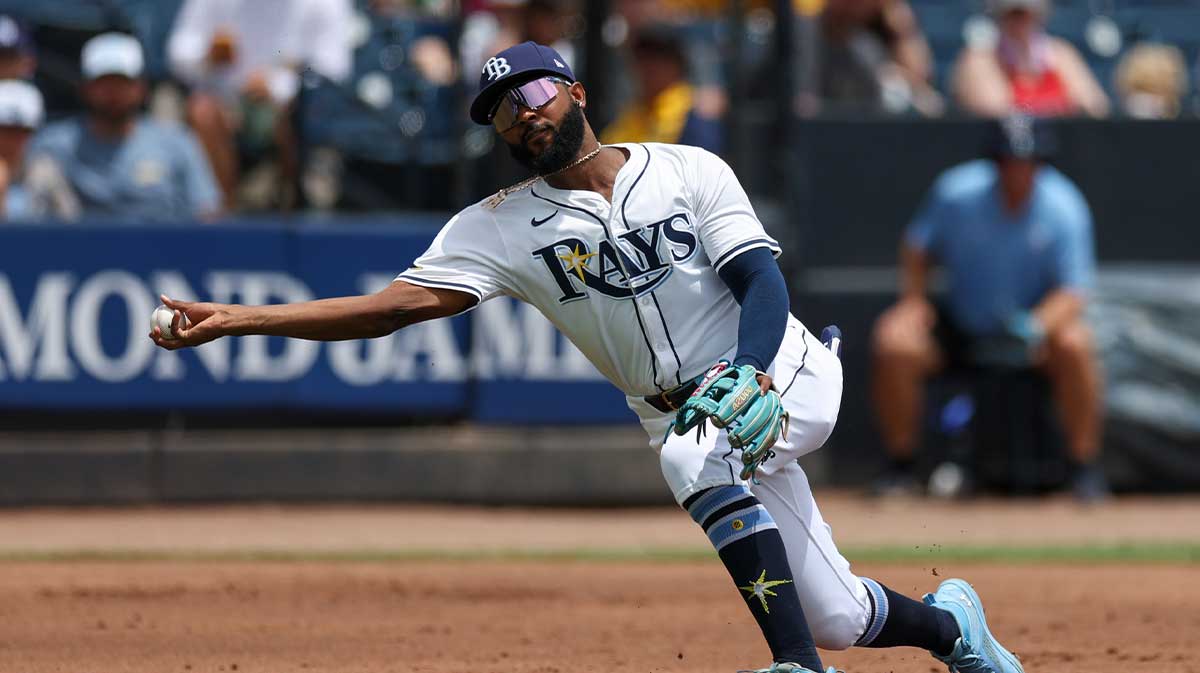 Tampa Bay Rays third baseman Junior Caminero (13) throws to first against the Oakland Athletics in the second inning at George M. Steinbrenner Field.