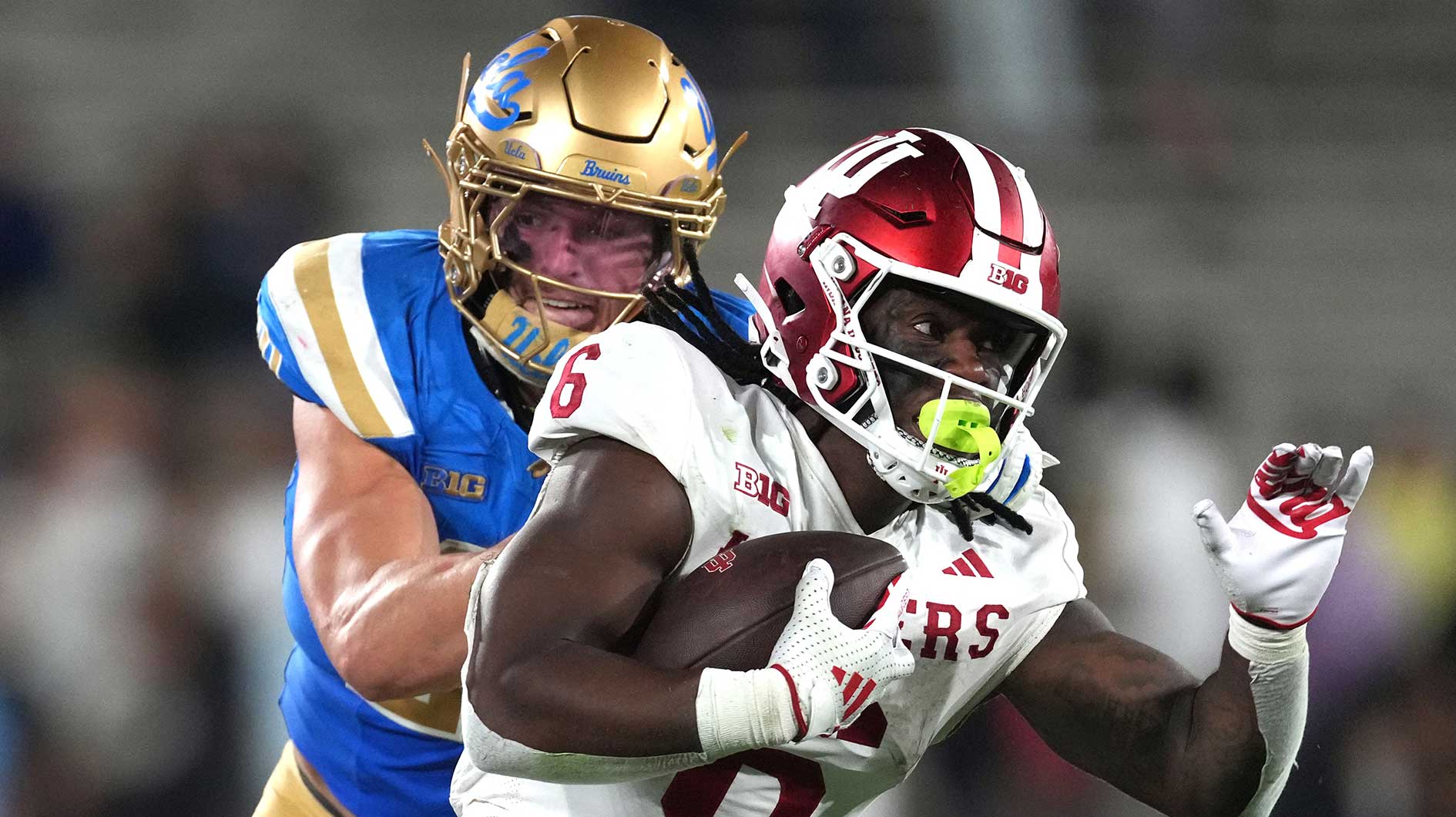 Indiana Hoosiers running back Justice Ellison (6) carries the ball against UCLA Bruins linebacker Kain Medrano (20) in the second half at Rose Bowl.