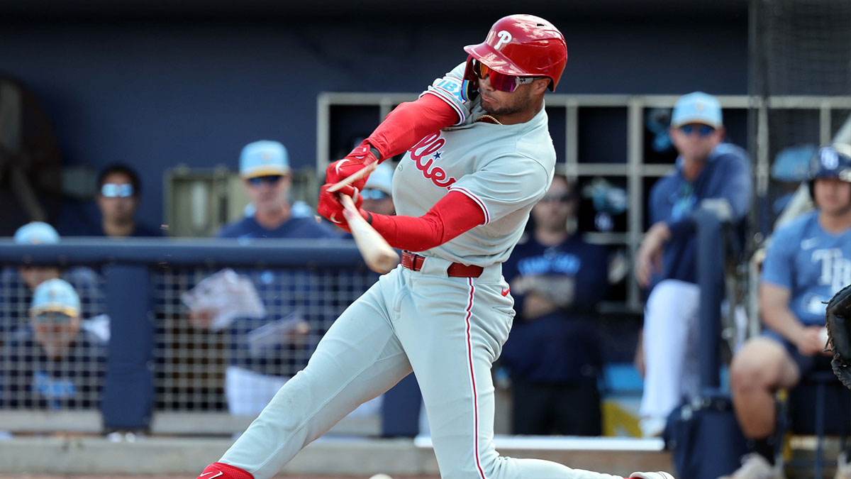 Philadelphia Phillies outfielder Justin Crawford (80) breaks his bat as he reaches on a fielders choice against the Tampa Bay Rays during the fourth inning at Charlotte Sports Park