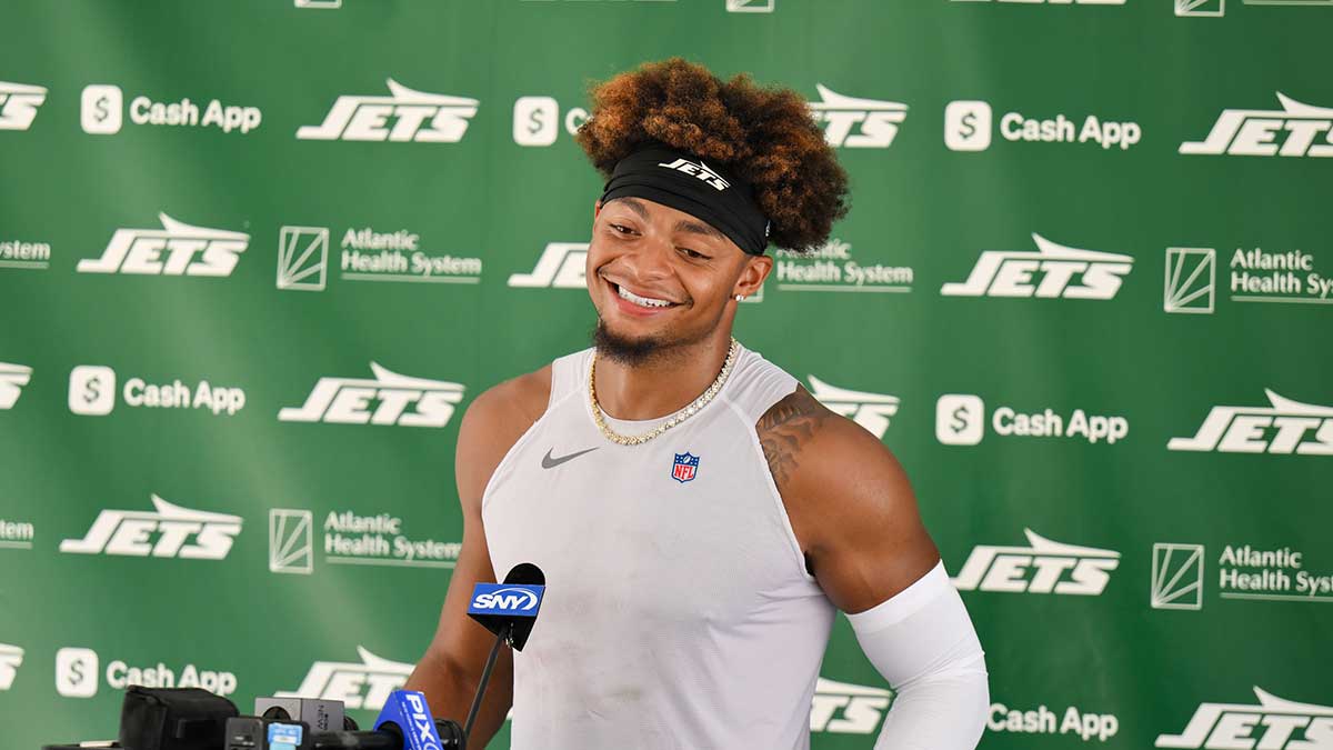 New York Jets quarterback Justin Fields (7) speaks at a press conference during training camp at Atlantic Health Jets Training Center.