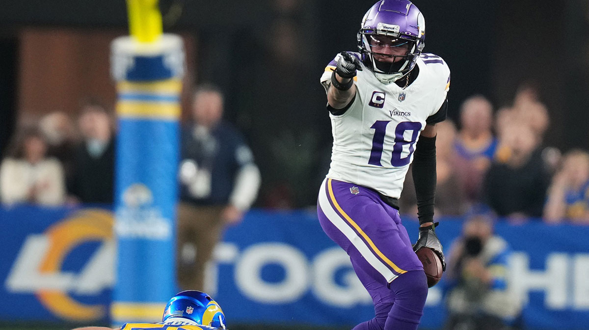 Minnesota Vikings receiver Justin Jefferson (18) signals a first down after a catch against the Los Angeles Rams during their playoff game at State Farm Stadium on Jan. 13, 2025, in Glendale.