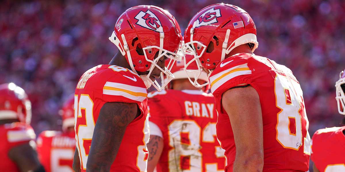 Kansas City Chiefs tight end Travis Kelce (87) celebrates with wide receiver Justyn Ross (82) after scoring against the Denver Broncos during the game at GEHA Field at Arrowhead Stadium.
