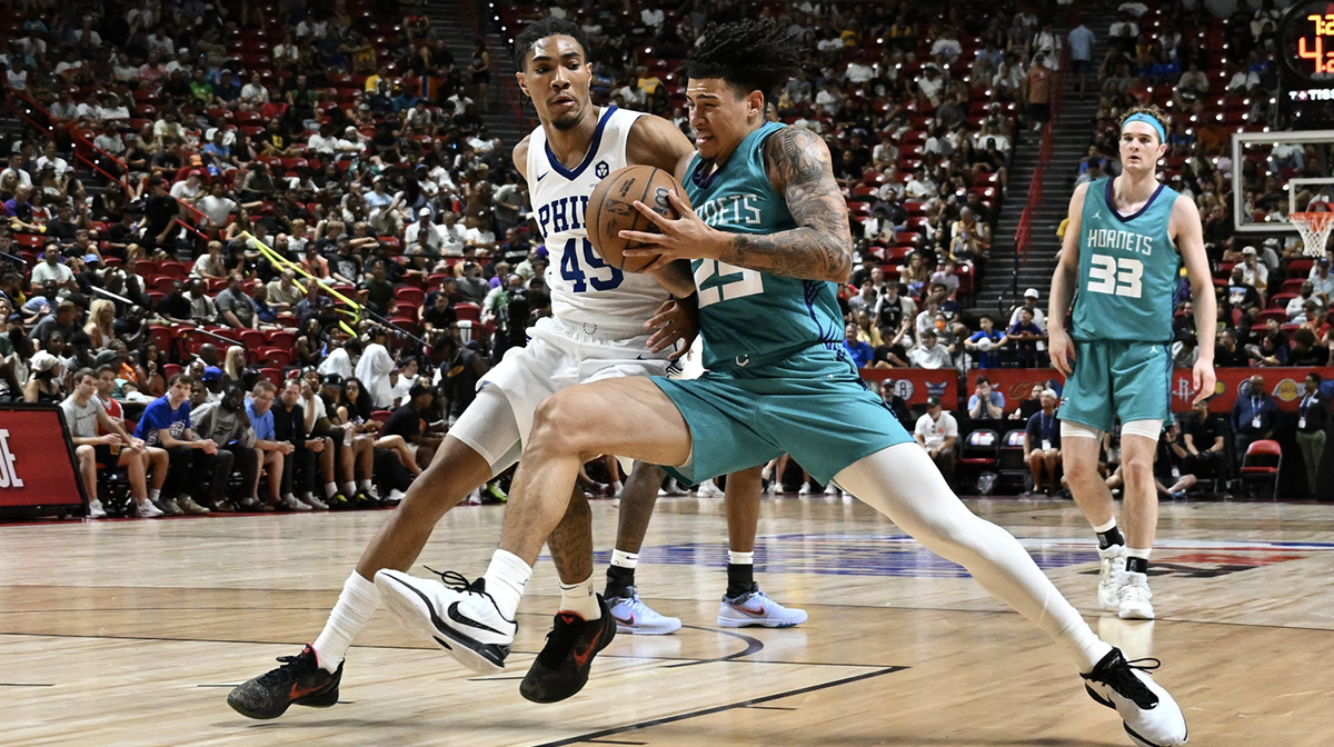 Charlotte Hornets guard KJ Simpson (25) collides with Philadelphia 76ers forward Hunter Sallis (45) in the third quarter of their game at Thomas & Mack Center.