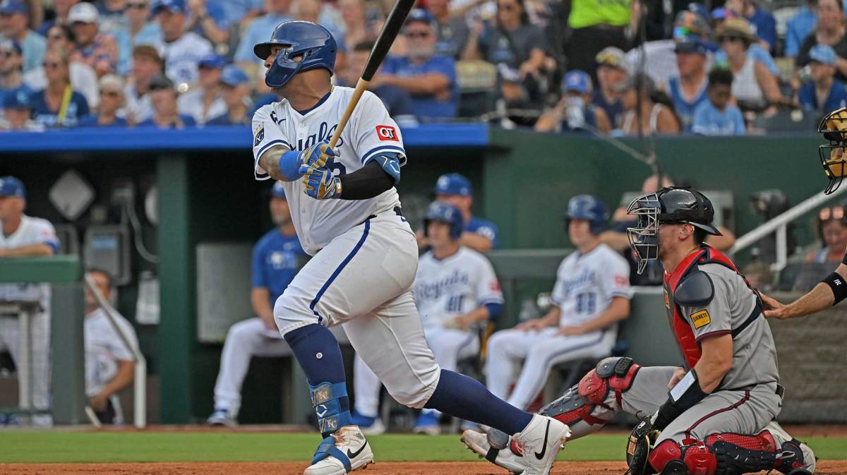 Kansas City Royals catcher Salvador Perez (13) singles in a run in the first inning against the Atlanta Braves at Kauffman Stadium.