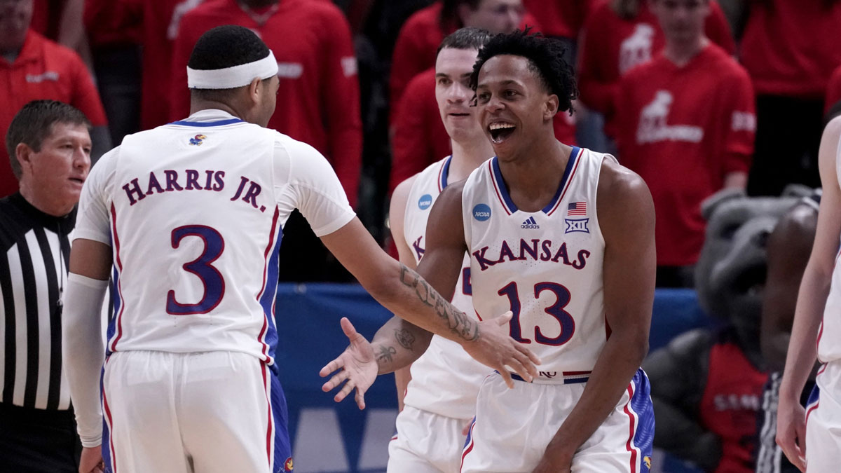 Kansas Jayhawks guard Elmarko Jackson (13) celebrates with guard Dajuan Harris Jr. (3) during the second half in the first round of the 2024 NCAA Tournament against the Samford Bulldogs at Vivint Smart Home Arena-Delta Center.