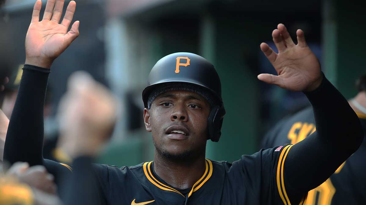 Pittsburgh Pirates third baseman Ke'Bryan Hayes (13) celebrates in the dugout after scoring a run against the Detroit Tigers during the second inning at PNC Park.