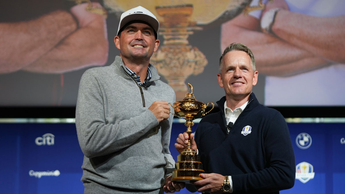 US team captain Keegan Bradley, left, and Europe team captain Luke Donald take a photo with the Ryder Cup after a press conference at Times Center