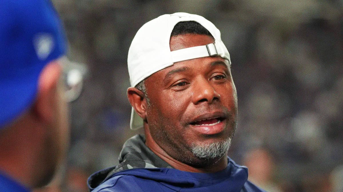Seattle Mariners former player Ken Griffey Jr. talks on the field before the game between the Los Angeles Dodgers