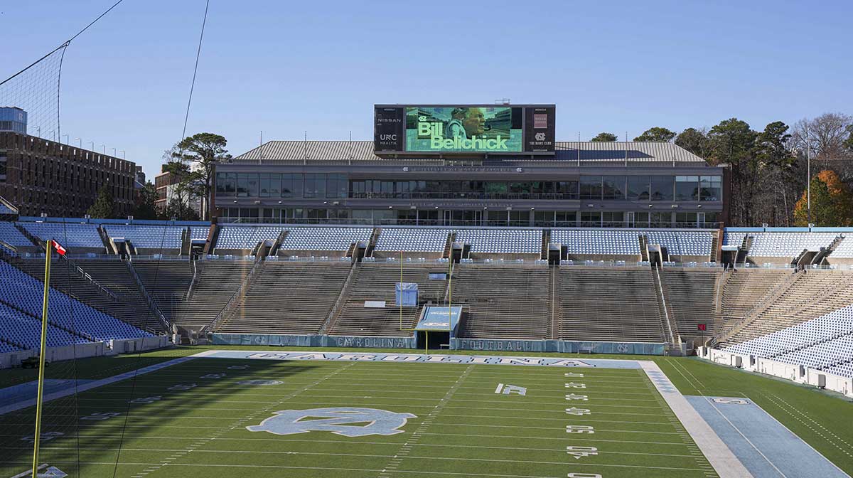 Monitors with signage in Kenan Stadium announcing the hiring of North Carolina Tar Heels new head coach Bill Belichick at Loudermilk Center for Excellence.