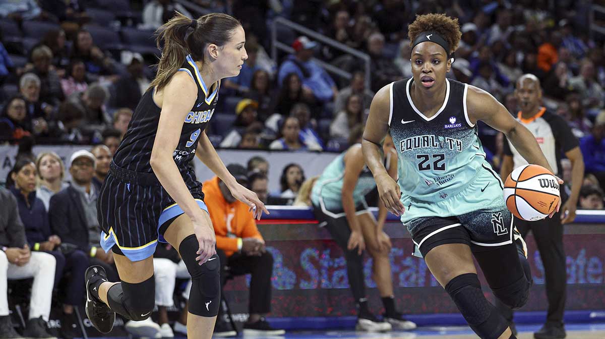 New York Liberty forward Kennedy Burke (22) drives to the basket against Chicago Sky guard Rebecca Allen (9) during the first half at Wintrust Arena.