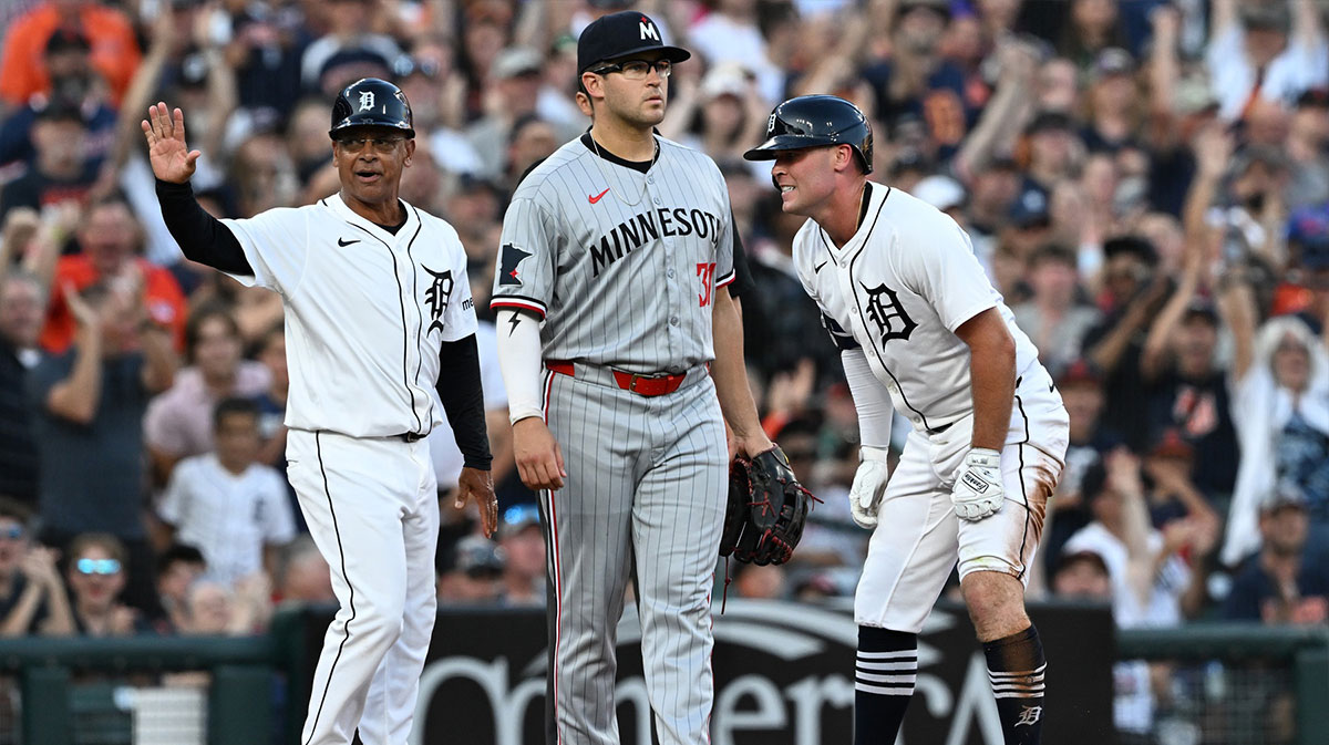 Detroit Tigers right fielder Kerry Carpenter (30) grimaces in pain after sliding into third base with an RBI triple against the Minnesota Twins in the fifth inning at Comerica Park.