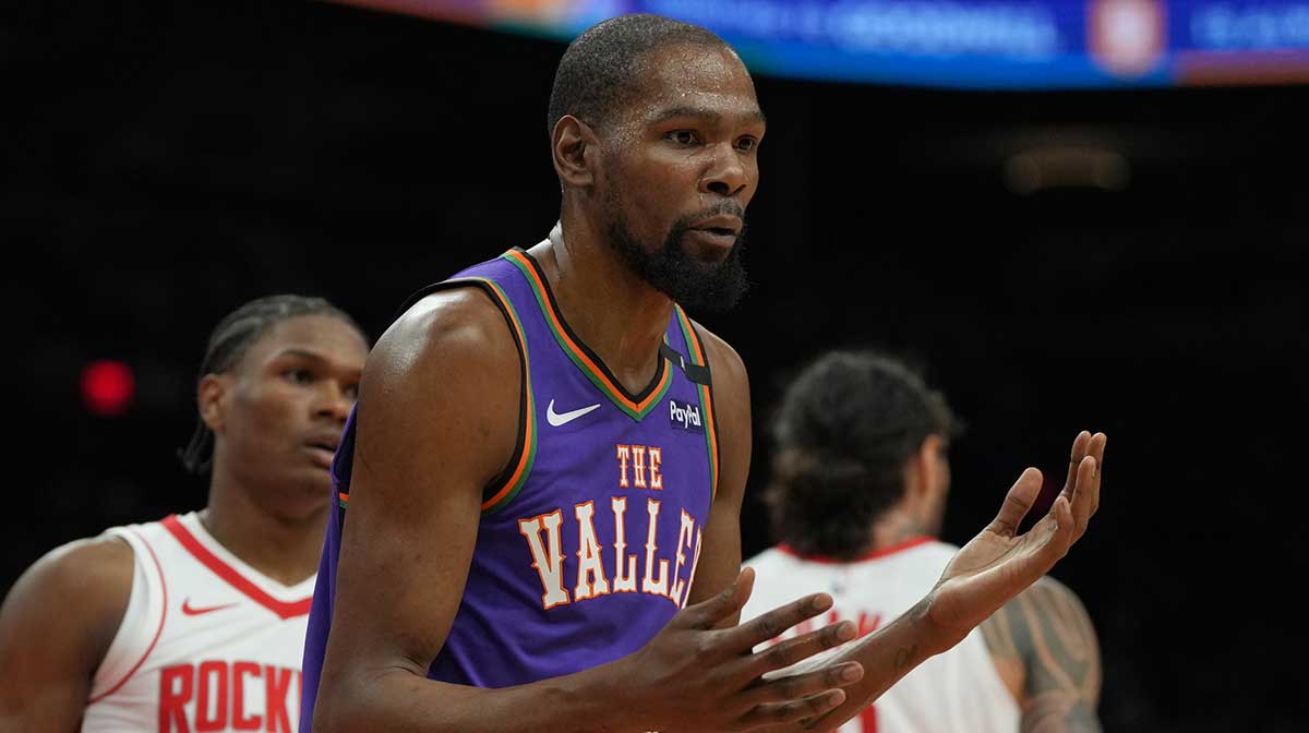 Phoenix Suns forward Kevin Durant (35) reacts after fouling a Houston Rockets player in the first half at Footprint Center.