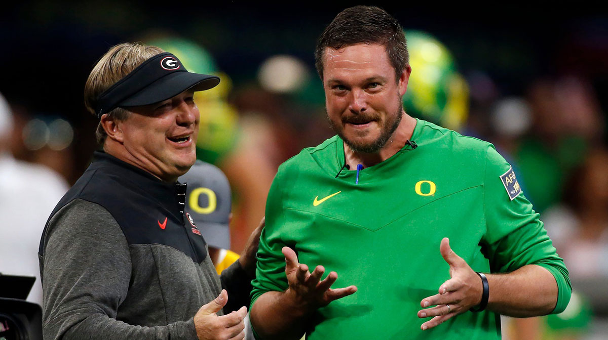 Georgia head coach Kirby Smart and Oregon head coach Dan Lanning meet during warm ups before the start of the Chick-fil-A Kickoff NCAA college football game between Oregon and Georgia