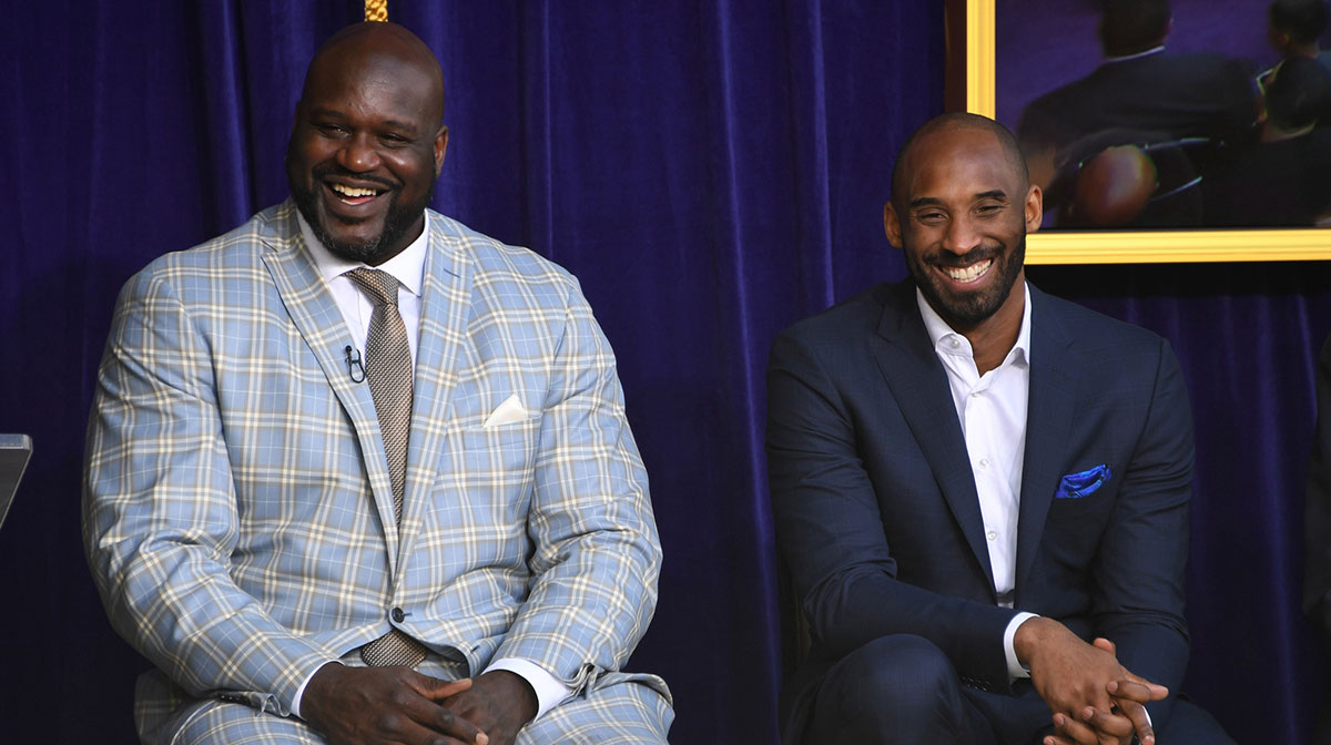 Los Angeles Lakers former center Shaquille O'Neal (left) and guard Kobe Bryant react during ceremony to unveil statue of O'Neal at Staples Center.