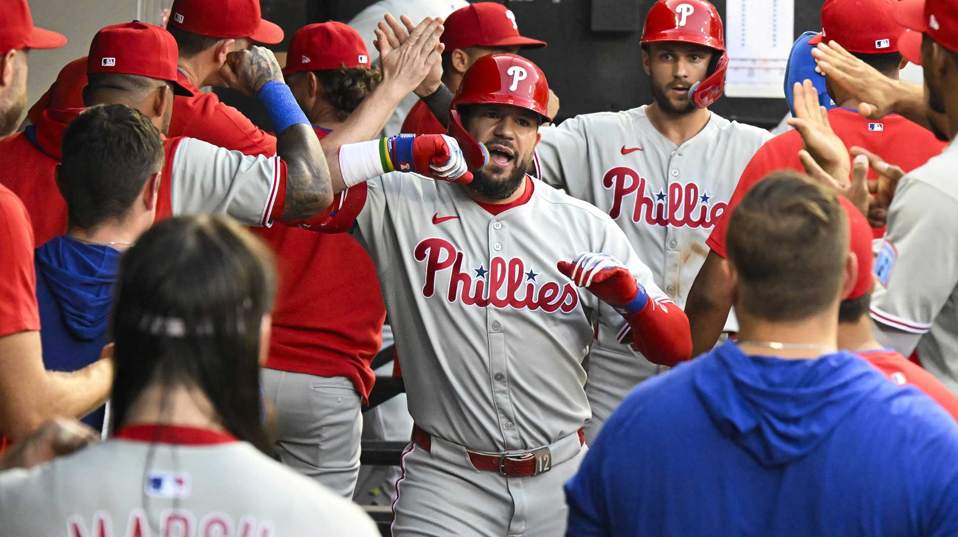 Philadelphia Phillies outfielder Kyle Schwarber (12) celebrates in the dugout after hitting a two-run home run during the third inning against the Chicago White Sox at Rate Field.