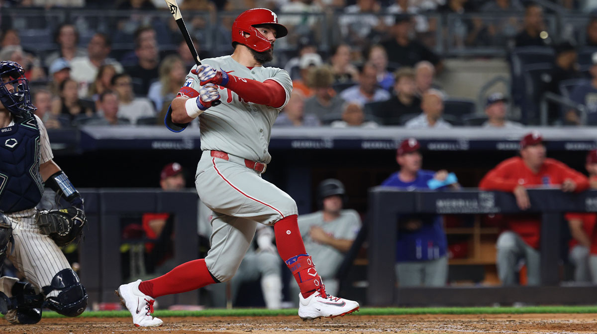 Philadelphia Phillies designated hitter Kyle Schwarber (12) hits a two run home run during the eighth inning against the New York Yankees at Yankee Stadium.