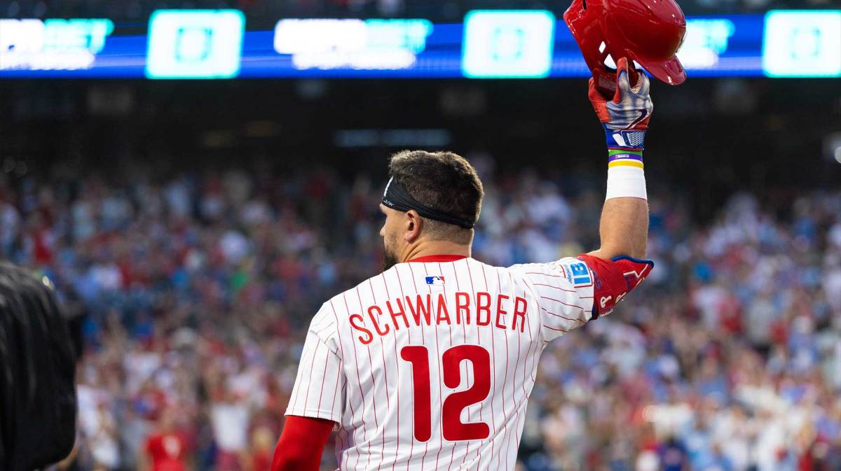 Philadelphia Phillies outfielder Kyle Schwarber (12) comes out of the dugout for a curtin call after his grand slam during the sixth inning against the Los Angeles Angels at Citizens Bank Park.